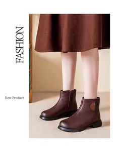 Dark brown leather ankle boots for women with side zipper and decorative patch detail