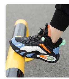 Close-up of boys' winter sports sneakers with warm fur lining and dial lacing system.