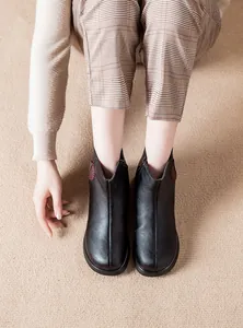 Comfortable black leather ankle boots for women with warm plush lining and heart detail