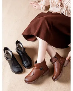 Close-up display of cozy winter ankle boots with warm fleece lining and flower detail