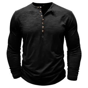 Detail view of a black long-sleeve Henley shirt with slub texture and wooden buttons.