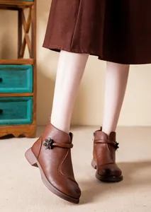 Brown leather ankle boots for women with elegant floral buckle detail