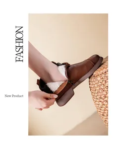 Detail of comfortable brown leather winter boots featuring thick white fleece lining