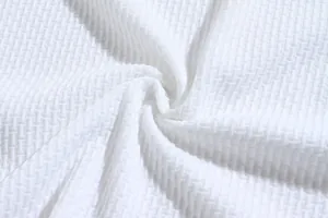 Macro detail of breathable white seersucker fabric texture for men's casual shirts