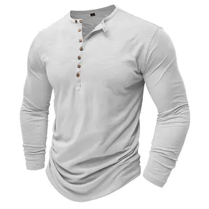 Detailed view of light grey men's long-sleeve Henley shirt with unique slub texture