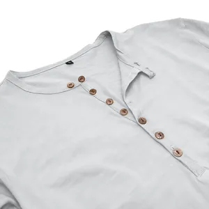 Macro detail of men's Henley shirt with wooden buttons and slub fabric texture