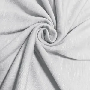 Close-up macro view of light gray slub polyester fabric texture for men's casual T-shirt