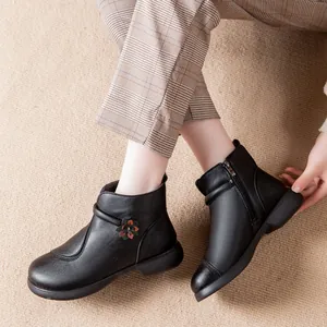 Comfortable black leather ankle boots with floral detail and warm lining for women