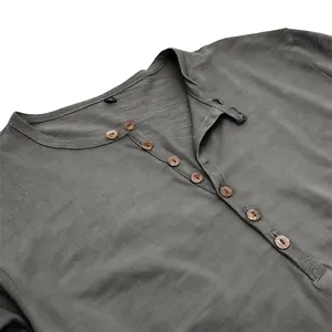 Detailed view of gray men's Henley long-sleeve shirt with slub fabric and wooden buttons