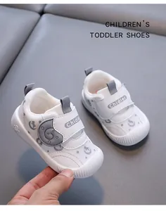 Close-up of white breathable mesh toddler shoes with adjustable Velcro straps