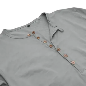 Detailed view of grey-blue Henley shirt with slub texture and wooden buttons