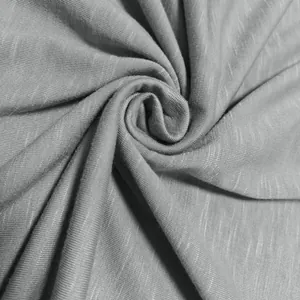 Macro shot showing the grey slub jersey fabric texture of this men's T-shirt shirt