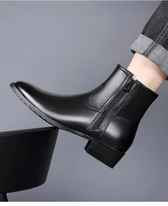Side view detail of a sleek black leather Chelsea boot with a side zipper for men.