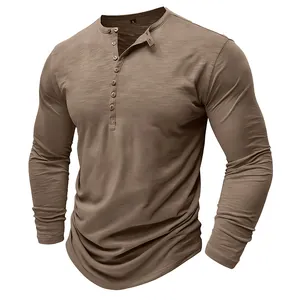 Macro detail of men's long-sleeve Henley shirt featuring slub texture and buttons