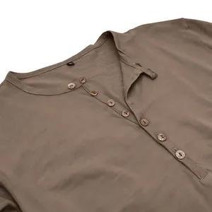 Close-up detail of men's brown slub polyester Henley shirt with wooden buttons