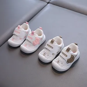 Breathable mesh baby walker shoes with soft non-slip soles in pink and khaki.