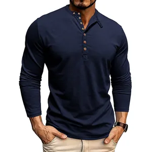Close-up of navy blue slub fabric men's long-sleeved Henley shirt with button detail