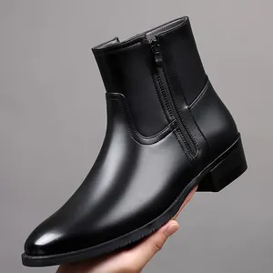 Side view detail of sleek black men's leather boots featuring a secure metal side zipper
