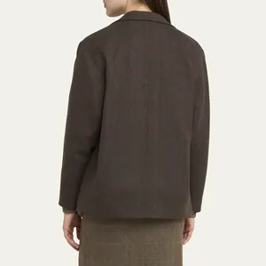 Elegant back view of a brown plaid blazer featuring high-end Japanese urea buttons
