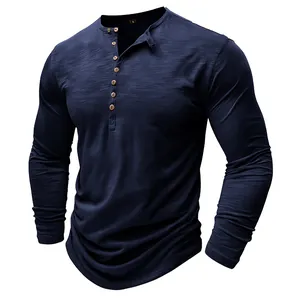 Close-up detail of a navy blue slub fabric long-sleeved Henley T-shirt with wooden buttons