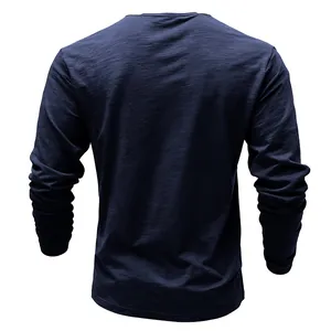 Back view of a navy blue long-sleeved T-shirt featuring slub fabric texture