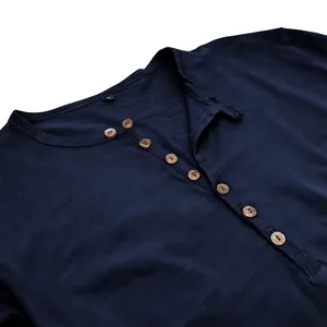 Detail showing neckline and wooden buttons of navy blue slub fabric Henley shirt