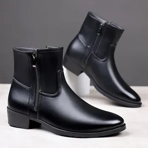 Detail view of men's black leather ankle boots with sleek side zipper and low block heel