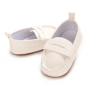 Detailed close-up of white soft-sole baby loafers with non-slip bottom for infants