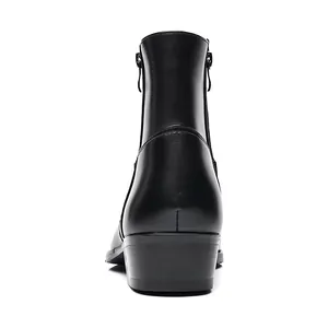 Detailed rear view of premium black leather men's Chelsea boots featuring side zippers