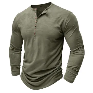 Detailed view of the slub fabric texture and button placket on an olive green Henley shirt