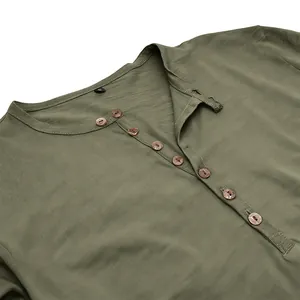 Close-up of olive green men's Henley shirt with slub texture and wooden buttons