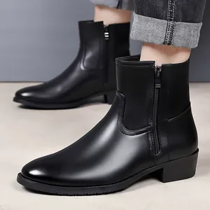Close-up of men's black leather Chelsea boots with side zipper and business style