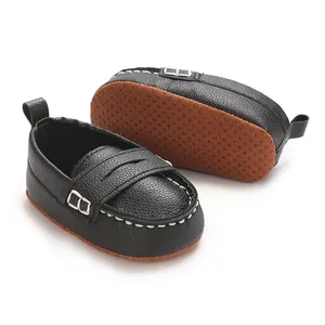 Detailed view of black infant soft sole loafers with anti-slip brown dotted sole
