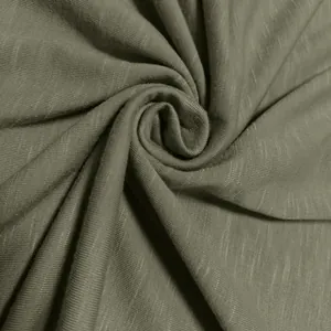 Close-up macro view of the olive green slub knit polyester fabric showing rich texture