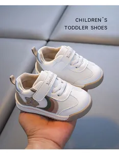 Detailed view of breathable white toddler sports shoes with convenient Velcro strap.