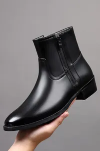 Close-up of black genuine leather Martin boot with side zipper detail