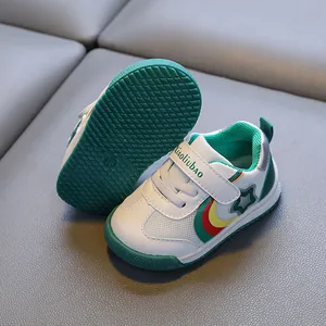 Breathable toddler sneakers with non-slip green rubber soles and rainbow star design