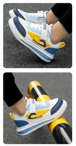 Close-up detail of boys durable leather sneakers in a blue and white casual style
