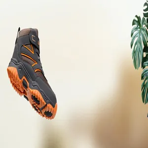 Detail view of professional high-top children's outdoor hiking shoes in grey and orange