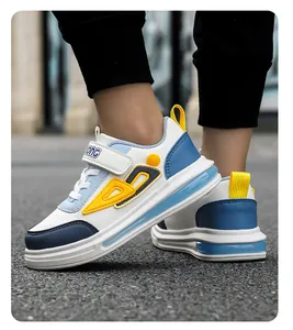 Detailed side view of boys' casual sneakers in white, blue and yellow