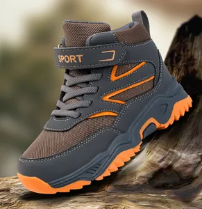 Detail of boys high-top outdoor hiking shoe with durable tread and velcro strap