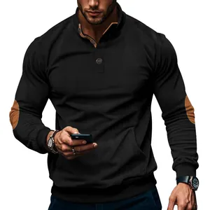 Detailed view of men's black corduroy henley sweatshirt featuring brown elbow patches and pocket