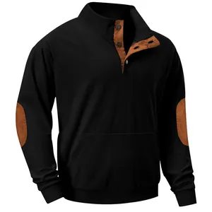 Close-up detail of black corduroy sweatshirt with brown elbow patches and stand collar