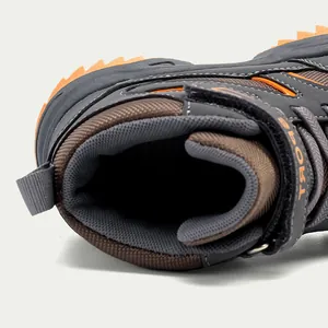 Close-up macro detail of children's high-top hiking boot with breathable mesh lining