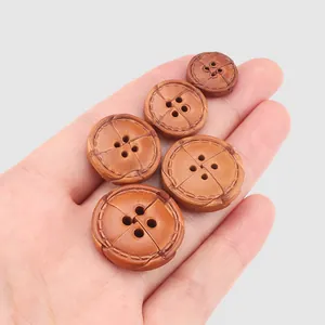 High quality brown cowhide leather buttons with four holes and stitch detail for coats