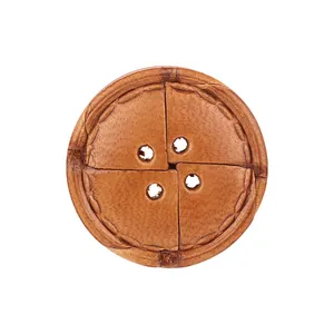 High-quality round brown cow leather button with four holes and stitched detail