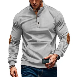 Detail view of a men's grey corduroy sweatshirt with stand collar and elbow patches