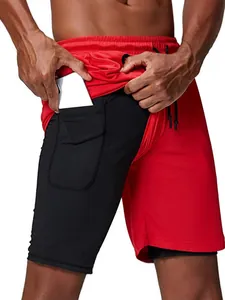 Functional men's 2-in-1 sports shorts in red and black featuring an inner phone pocket.