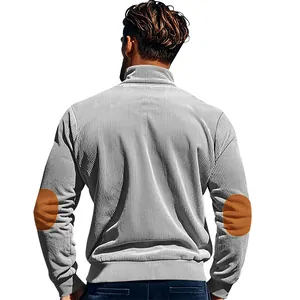 Rear view detail of grey corduroy sweatshirt with contrast brown elbow patches.
