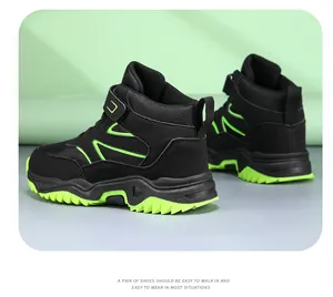 Detailed back view of black and neon green children high-top hiking shoes for boys